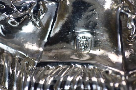 A pair of late George II embossed silver candlesticks, by William Tuite, weighted.